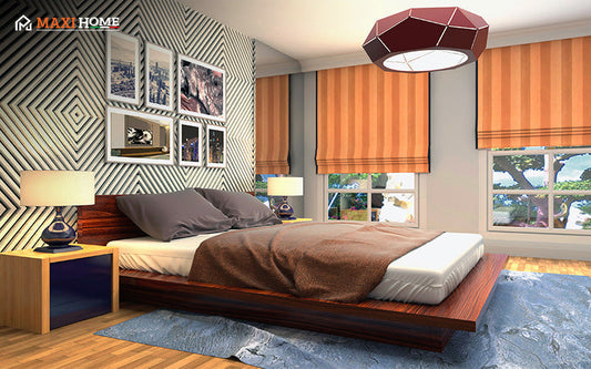 A modern bedroom featuring a low wood bed, a black-and-white geometric accent wall, orange window treatments, and a red pendant light