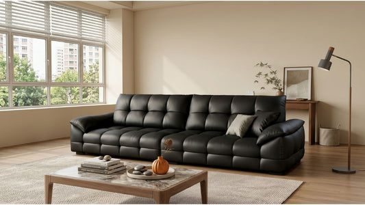 Black leather sofa in a bright modern Singapore living room with coffee table and natural window light