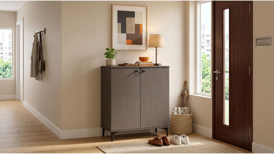Brown built-in style shoe cabinet in a modern Singapore foyer with entryway shoes and wooden door