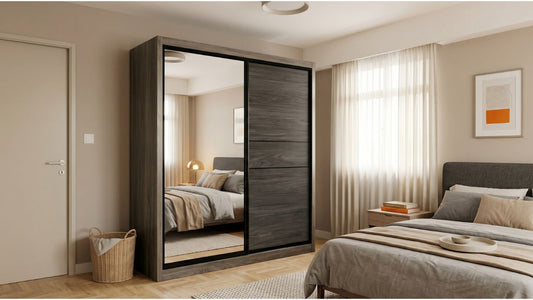 Tall dark wood sliding wardrobe with mirror panel in a modern Singapore bedroom with neutral decor
