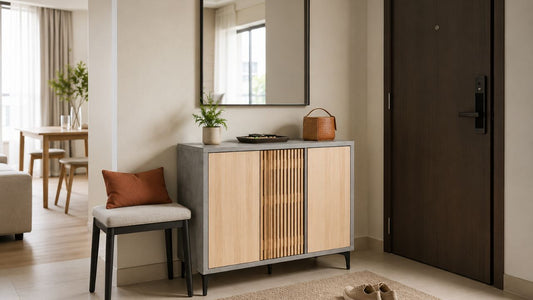 Custom shoe cabinet and foyer storage in a modern Singapore HDB or condo entryway with warm wood doors, mirror, bench, rug, and practical everyday styling.