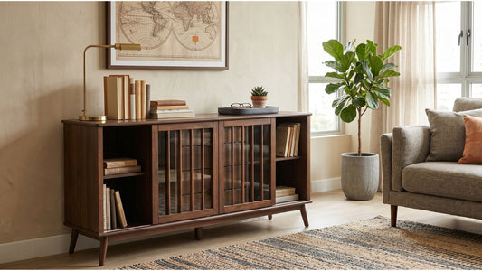 Dark wood bookcase with glass sliding doors beside a sofa in a warm modern Singapore living room