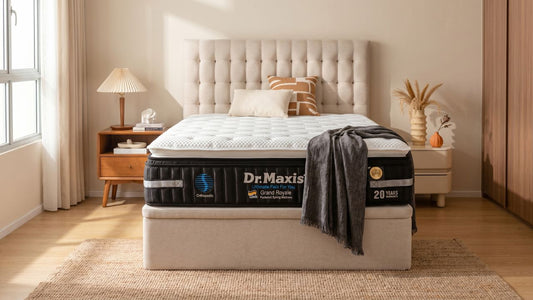Dr Maxis Grand Royale mattress on beige bed frame in a warm Singapore bedroom