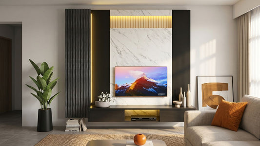 Feature-wall TV console with black fluted panels, marble-look centre wall, warm lighting, and floating storage in a modern Singapore living room.