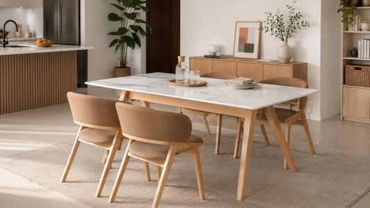 Marble-look dining table with tan chairs in a modern Singapore home for a furniture shopping glossary