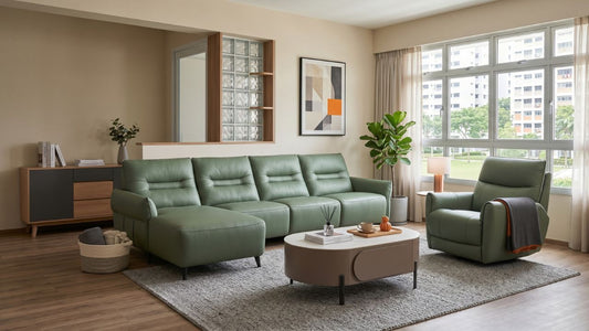 Green leather sectional sofa with matching recliner in a bright Singapore HDB living room