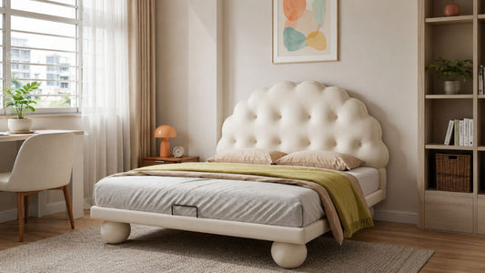 Cream upholstered single bed with scalloped tufted headboard in a modern Singapore HDB children’s bedroom with warm neutral tones and natural daylight.