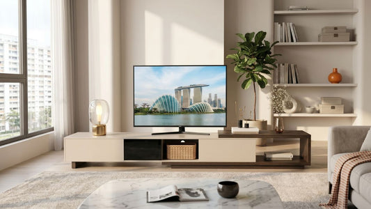 Modern TV console with living room storage in a bright Singapore HDB home with shelves, sofa, and coffee table