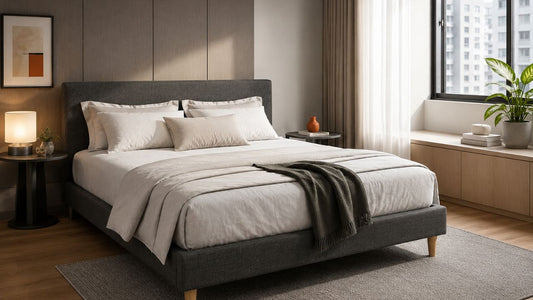 Grey upholstered bed in a modern Singapore bedroom for comparing pillow-top, euro-top, and tight-top mattresses
