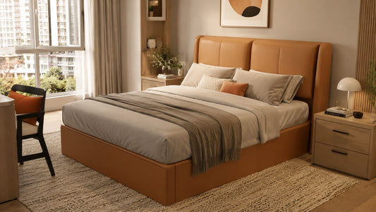 Tan upholstered bed frame in a modern Singapore bedroom with warm wood tones, neutral bedding, and soft natural daylight.