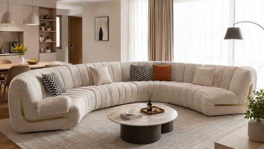 U-shaped sectional sofa in a warm modern Singapore living room with neutral decor, marble coffee table, and space-smart open-plan layout