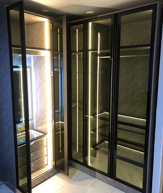 Modern glass display case with silver aluminum and steel design.